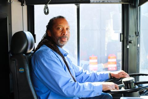 Bus driver sitting on a bus