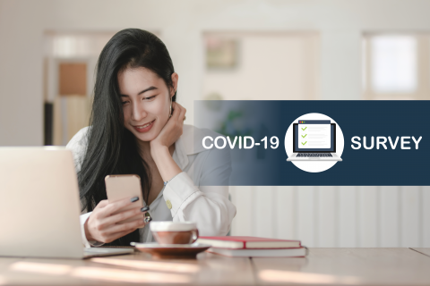 Woman sitting at desk with text "COVID-19 Survey"